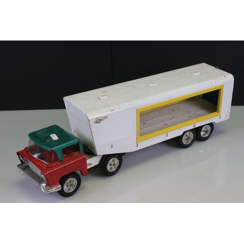 486 - Four large tin plate model toys to include Triang truck, Tonka Motor Mover, Marx High Lift Mobile Cr... 