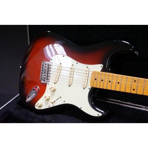 600 - Guitar - A stratocaster style electric guitar with Fender decals to headstock, in a Fender branded h... 