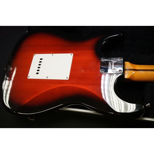 600 - Guitar - A stratocaster style electric guitar with Fender decals to headstock, in a Fender branded h... 