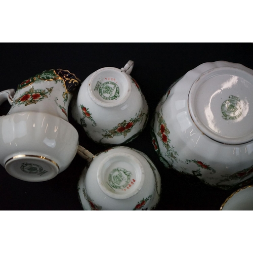 59 - Royal Albert Festoon Crown China Tea Ware to include 9 teacups and saucers, slop bowl, 12 small plat... 