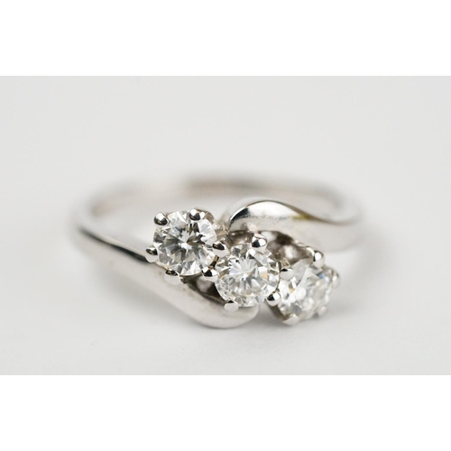 341 - Diamond 18ct white gold three stone crossover ring, three round brilliant cut diamonds, total stated... 