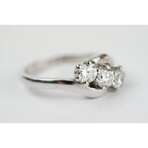 341 - Diamond 18ct white gold three stone crossover ring, three round brilliant cut diamonds, total stated... 