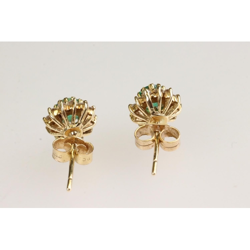 35 - Emerald and diamond 18ct yellow gold cluster earrings, the round mixed cut emerald measuring approx ... 