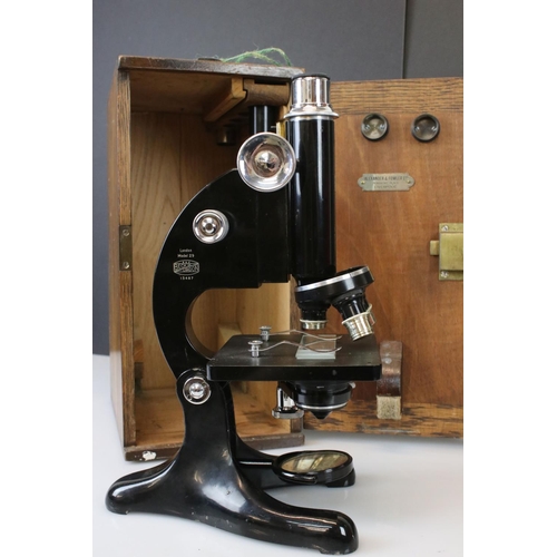 331 - A Beck Ltd of London model 29 microscope, serial no.13487, complete with lenses and original fitted ... 