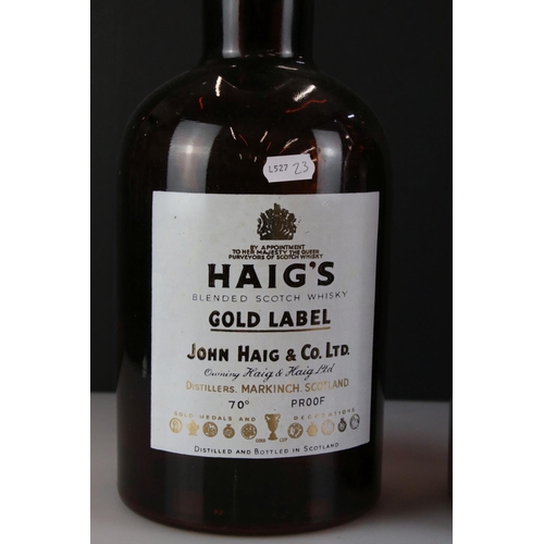 338 - A pair of Haig Whisky gold label shop display bottles, approx 40cm in height.