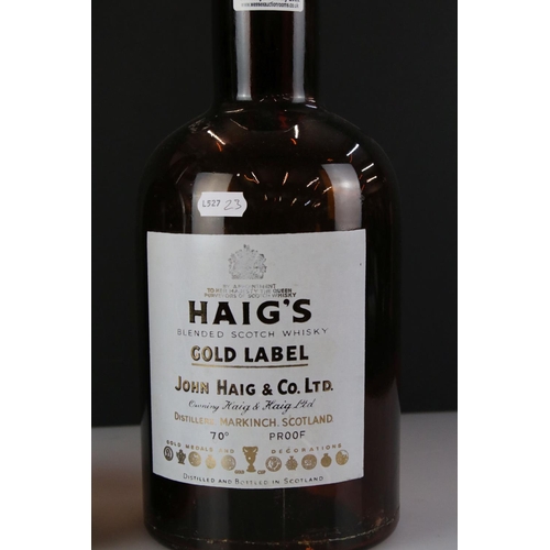 338 - A pair of Haig Whisky gold label shop display bottles, approx 40cm in height.