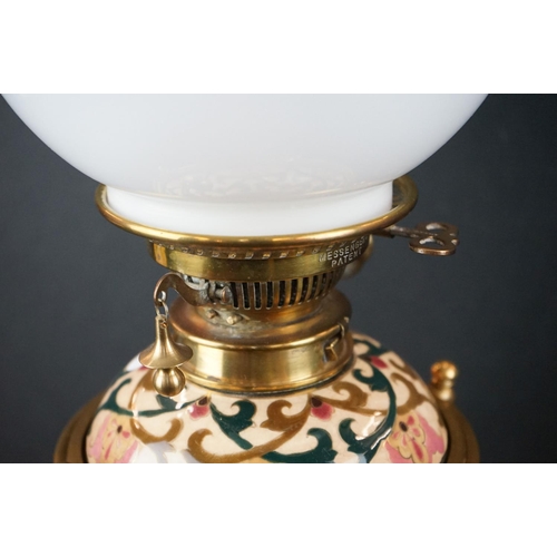 122 - Zolnay Pecs pink floral patterned Ceramic Oil Lamp with drop-in font and brass base, Messengers burn... 