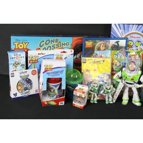 303 - Collection of Toy Story toys featuring 2 x carded Pez Dispensers, carded Magic Scribbler, carded Ali... 