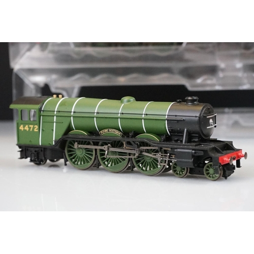 112 - Three Hornby OO gauge Flying Scotsman 4-6-2 LNER locomotives within custom plastic packaging