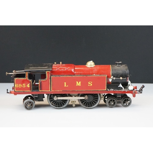 119 - Two Hornby O gauge locomotives to include 4-4-2 LMS 6954 in red and 0-4-0 1924 LMS in maroon with te... 