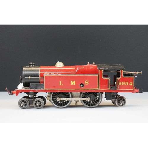 119 - Two Hornby O gauge locomotives to include 4-4-2 LMS 6954 in red and 0-4-0 1924 LMS in maroon with te... 