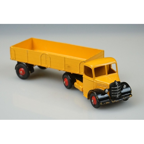 1056 - Two boxed Dinky Supertoys diecast models to include 521 Bedford Articulated Lorry in yellow with red... 