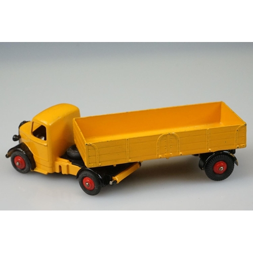 1056 - Two boxed Dinky Supertoys diecast models to include 521 Bedford Articulated Lorry in yellow with red... 