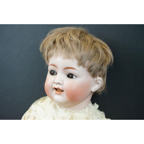 179 - Simon & Halbig bisque headed doll with brown glass flirty eyes, teeth, good face & hair, some cracki... 