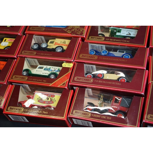 1145 - Around 69 boxed Matchbox Models of Yesteryear diecast models in red boxes, ex