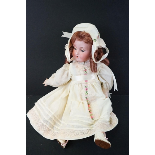 195 - Three early 20th C Armand Marseille bisque headed dolls to include 1 x with sleeping brown glass eye... 