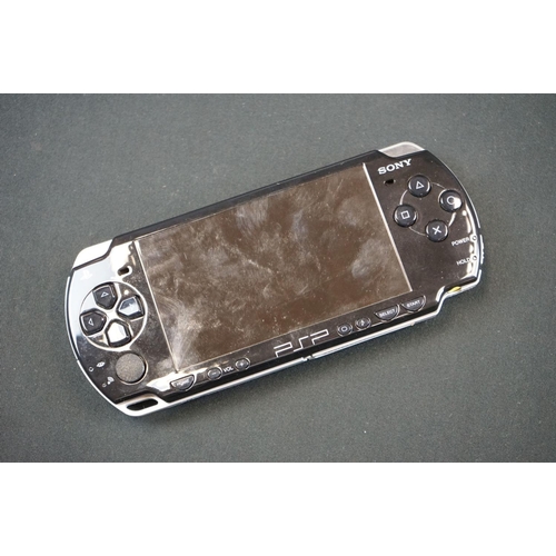 257 - Retro Gaming - PlayStation Portable 2003 with 4GB San Disk, official charger, PSP Camera, 5 x cased ... 