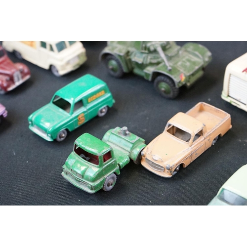 1264 - Around 40 mid 20th C play worn Matchbox Lesney diecast models plus roadside accessories