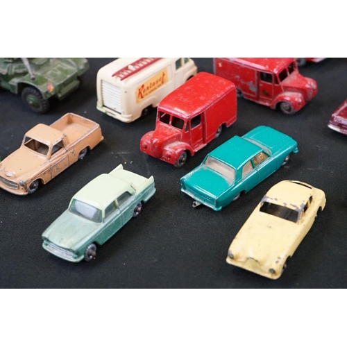 1264 - Around 40 mid 20th C play worn Matchbox Lesney diecast models plus roadside accessories