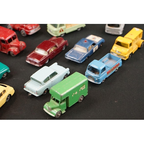 1264 - Around 40 mid 20th C play worn Matchbox Lesney diecast models plus roadside accessories