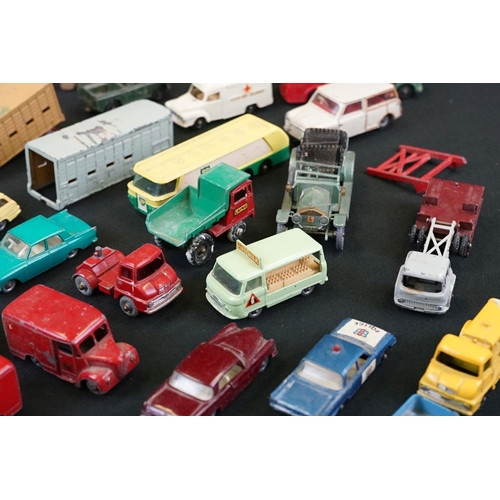 1264 - Around 40 mid 20th C play worn Matchbox Lesney diecast models plus roadside accessories