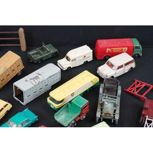 1264 - Around 40 mid 20th C play worn Matchbox Lesney diecast models plus roadside accessories