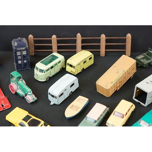 1264 - Around 40 mid 20th C play worn Matchbox Lesney diecast models plus roadside accessories