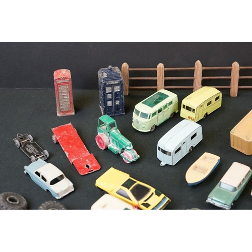 1264 - Around 40 mid 20th C play worn Matchbox Lesney diecast models plus roadside accessories