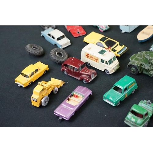 1264 - Around 40 mid 20th C play worn Matchbox Lesney diecast models plus roadside accessories