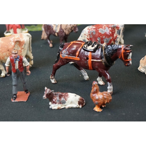 1369 - Small quantity of mid 20th C Britains play worn metal figures, mainly farm animals, featuring a milk... 