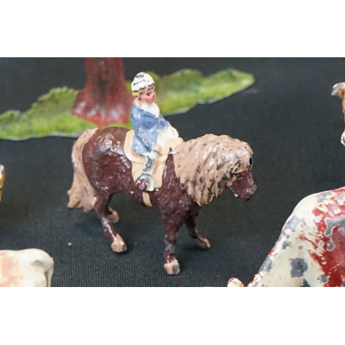 1369 - Small quantity of mid 20th C Britains play worn metal figures, mainly farm animals, featuring a milk... 