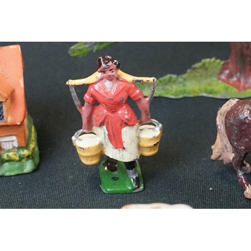 1369 - Small quantity of mid 20th C Britains play worn metal figures, mainly farm animals, featuring a milk... 