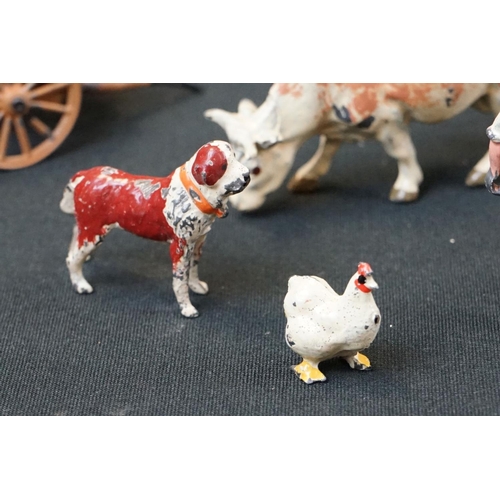 1369 - Small quantity of mid 20th C Britains play worn metal figures, mainly farm animals, featuring a milk... 