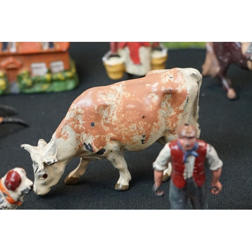 1369 - Small quantity of mid 20th C Britains play worn metal figures, mainly farm animals, featuring a milk... 