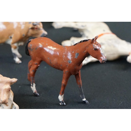 1369 - Small quantity of mid 20th C Britains play worn metal figures, mainly farm animals, featuring a milk... 