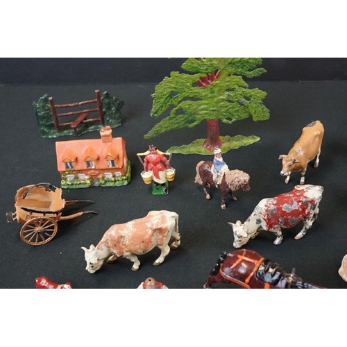 1369 - Small quantity of mid 20th C Britains play worn metal figures, mainly farm animals, featuring a milk... 