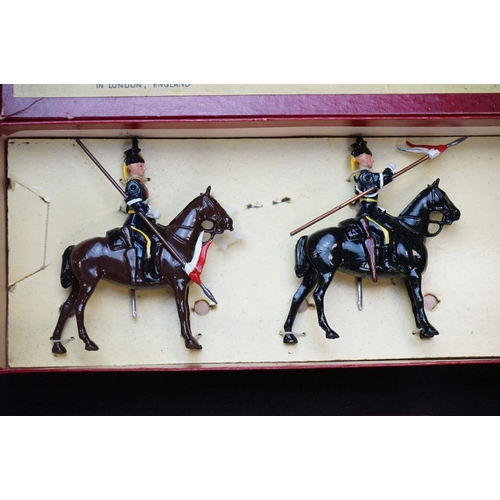 1390 - Four boxed Britains metal figure sets to include No 12 11th Hussars, No 4 2nd Lifeguards, No 24 9th ... 