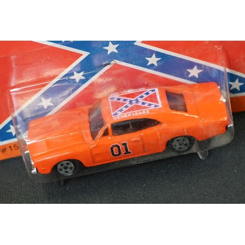 394 - Two carded ERTL Dukes of Hazard diecast models to include General Lee and Boss Hogg's Cadillac (unpu... 