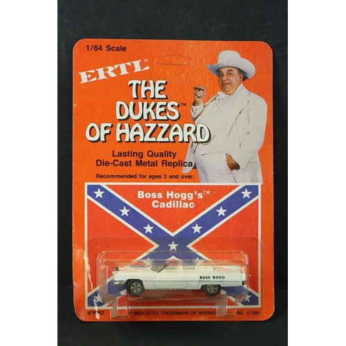 394 - Two carded ERTL Dukes of Hazard diecast models to include General Lee and Boss Hogg's Cadillac (unpu... 