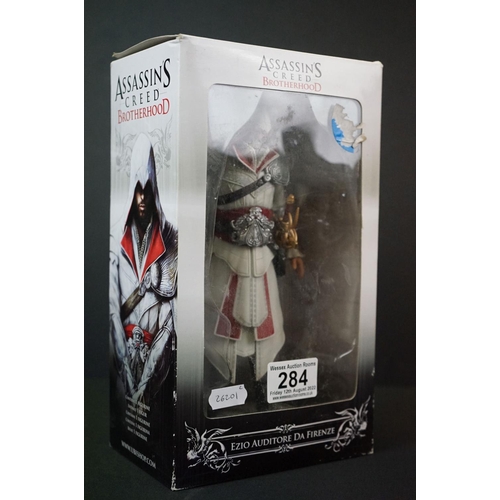 284 - Two boxed Assassins Creed figures to include AC2 Xbox 360 White Edition Ezio Auditore (figure & box ... 