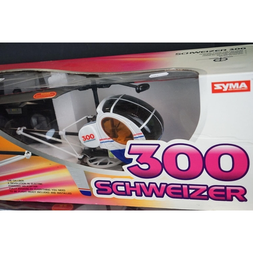 337 - Two boxed Syma Radio Control Schweizer 300 Helicopters, complete