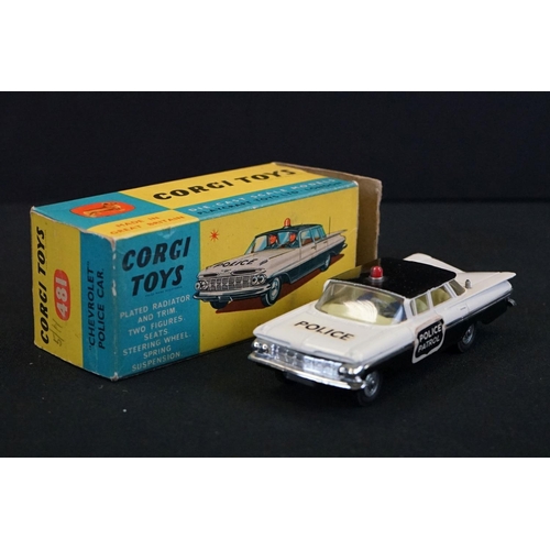 1239 - Boxed Corgi 481 Chevrolet Police Car (torn box end tab, diecast gd), together with a carded Corgi Cl... 