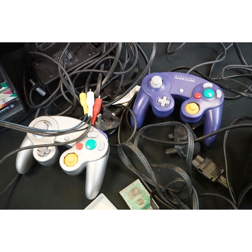 324 - Retro Gaming - Two Nintendo Game Cube consoles each with a controller (purple & silver) plus 15 x ca... 