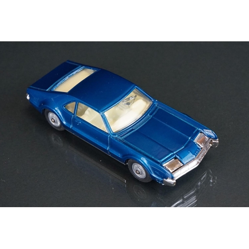 1033 - Two boxed Corgi diecast models to include 264 Oldsmobile Toronado in metallic blue and 245 Buick Riv... 