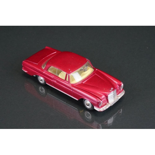 1035 - Three boxed Corgi diecast models to include 253 Mercedes Benz 220 SE Coupe in metallic maroon, 218 A... 