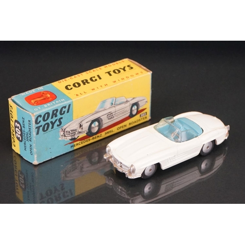 1037 - Two boxed Corgi diecast models to include 238 'By Special Request' Jaguar Mark X in metallic cerise ... 