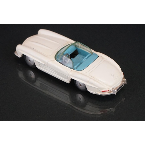 1037 - Two boxed Corgi diecast models to include 238 'By Special Request' Jaguar Mark X in metallic cerise ... 