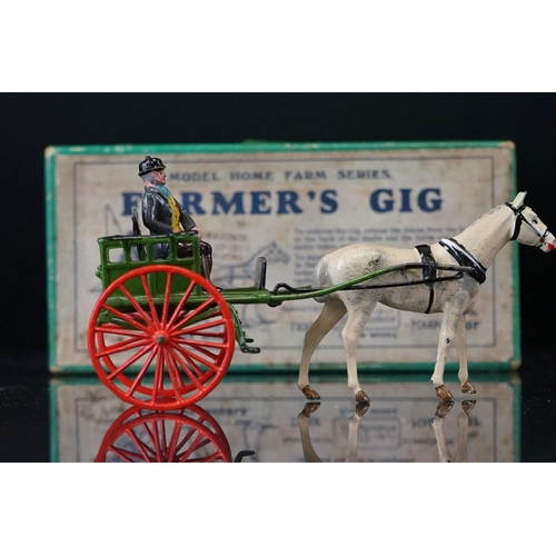 1067 - Four boxed Britains Home Farm Series metal models to include No 8F Horse Rake, No 20F Farmers Gig, N... 