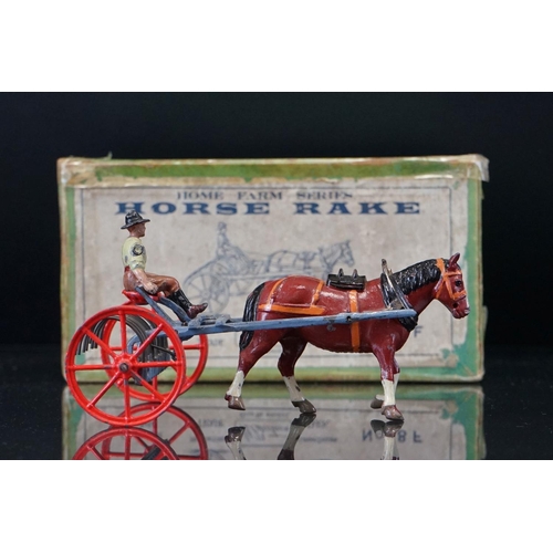 1067 - Four boxed Britains Home Farm Series metal models to include No 8F Horse Rake, No 20F Farmers Gig, N... 