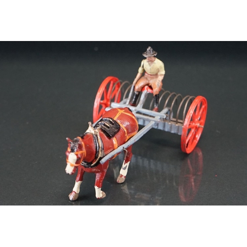 1067 - Four boxed Britains Home Farm Series metal models to include No 8F Horse Rake, No 20F Farmers Gig, N... 